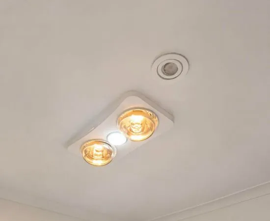 3-in-1 bathroom heat lamp, light and exhaust unit installed in a ceiling