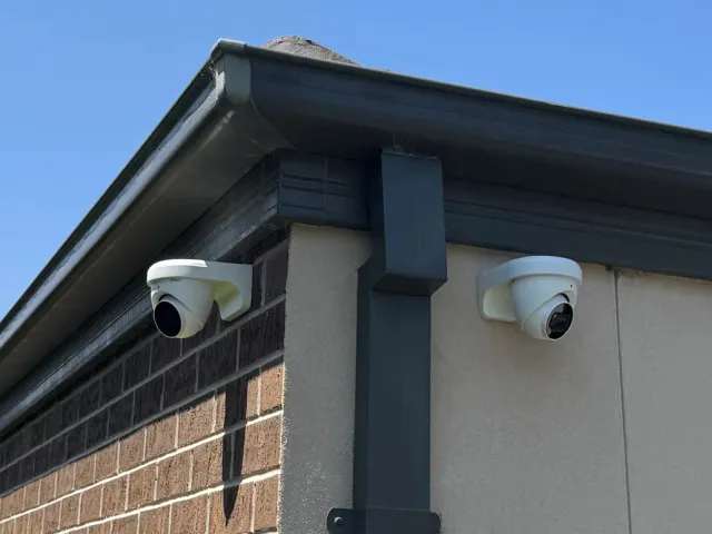 CCTV cameras installed under the eaves of a house