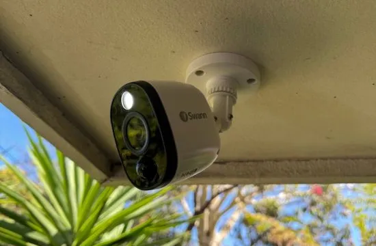 Outdoor security camera with floodlight under the eave of a Carrum Downs building