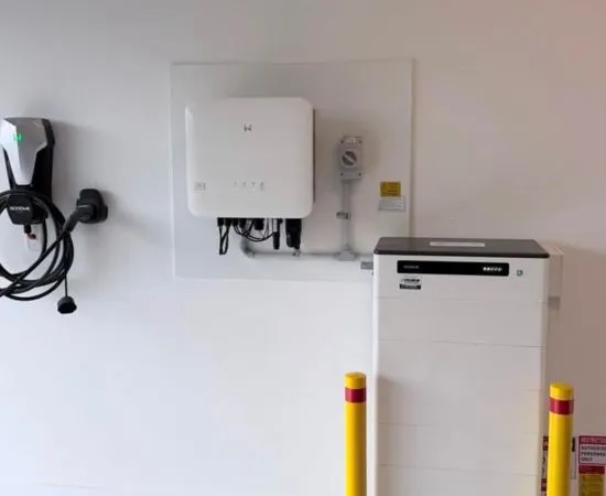 Wall-mounted inverter and home battery unit installed in a garage