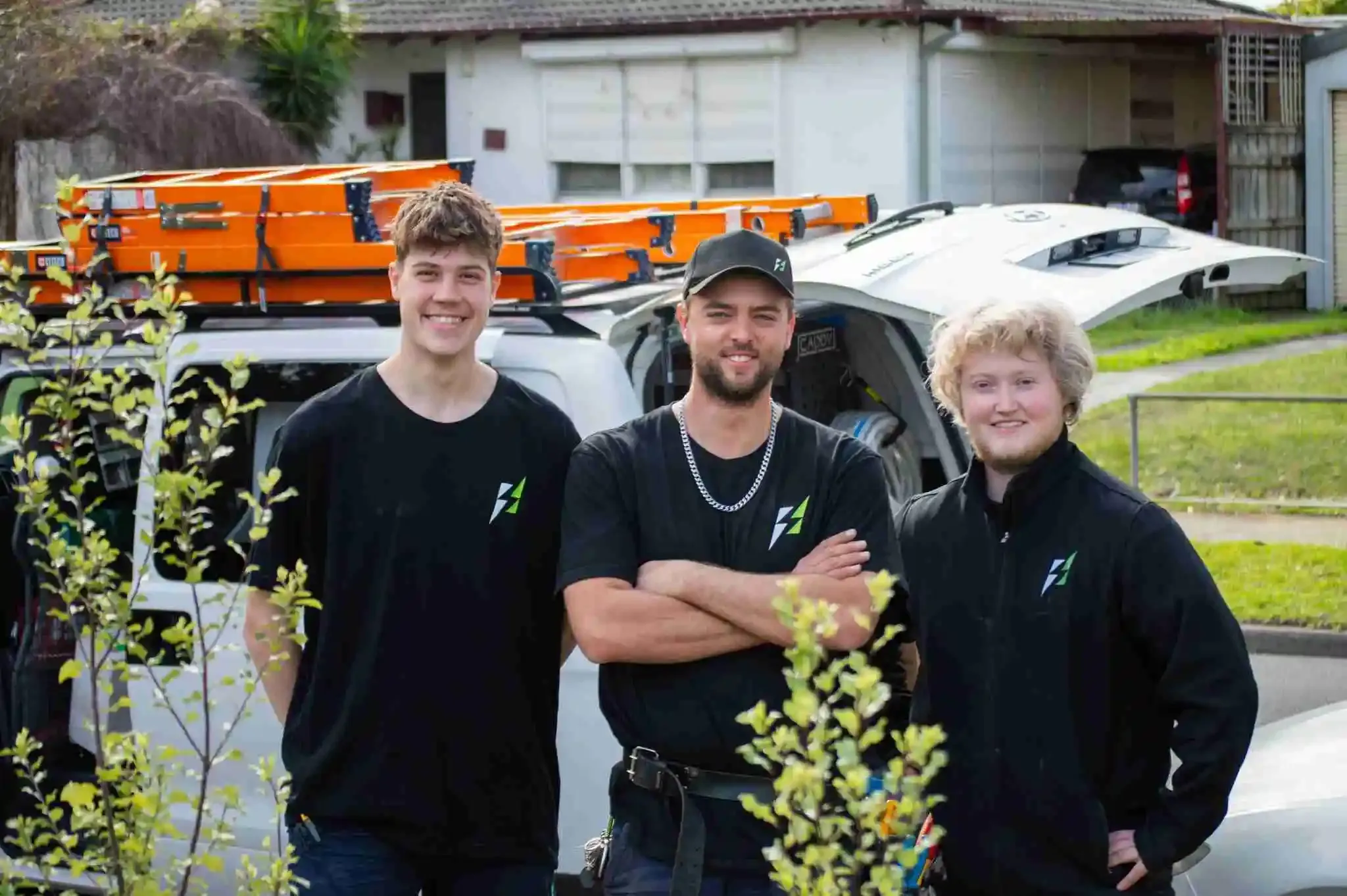 Nick, Will and Josh from Streamline Electrical standing in front of the work van